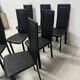 Set of eight designer chairs in black leather from the 20th century