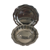 Two matching round dishes in stainless steel