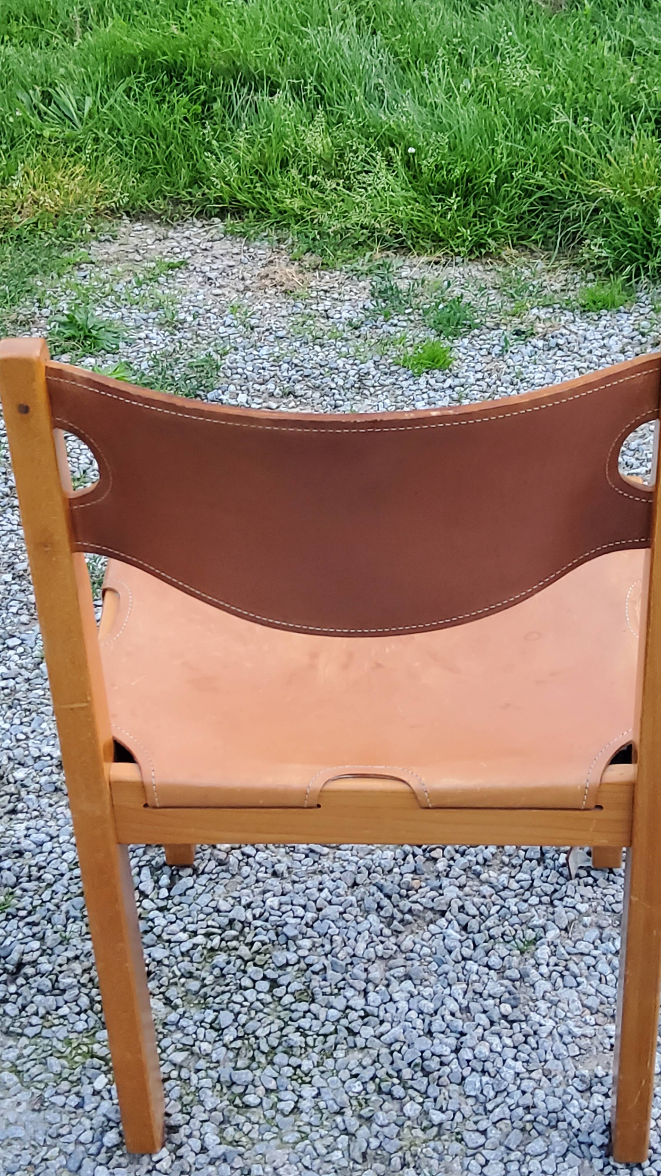 Pair of brutalist chairs in elm and stretched leather with saddle stitching Self publisher