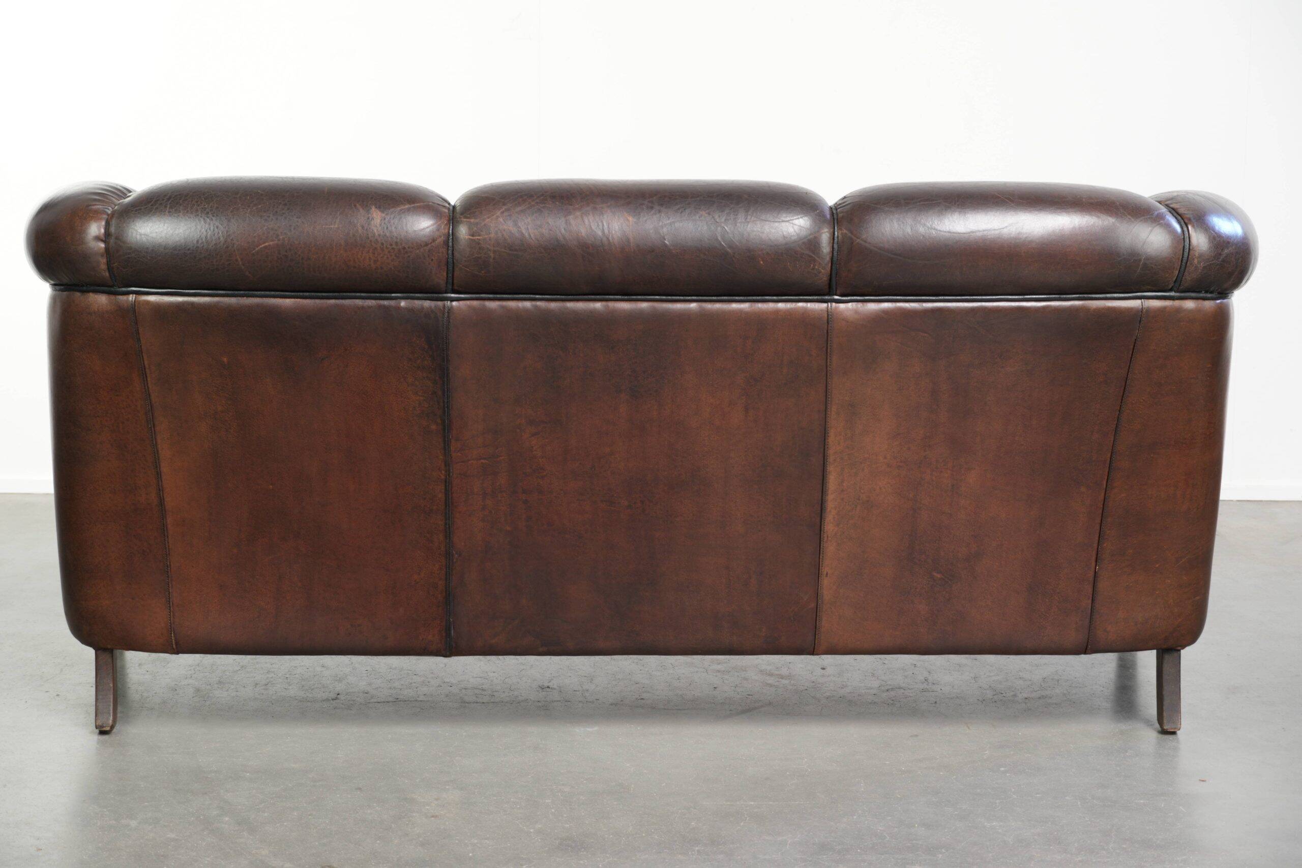 Unique sheepskin 3-seater sofa with deep colours and a distinctive design