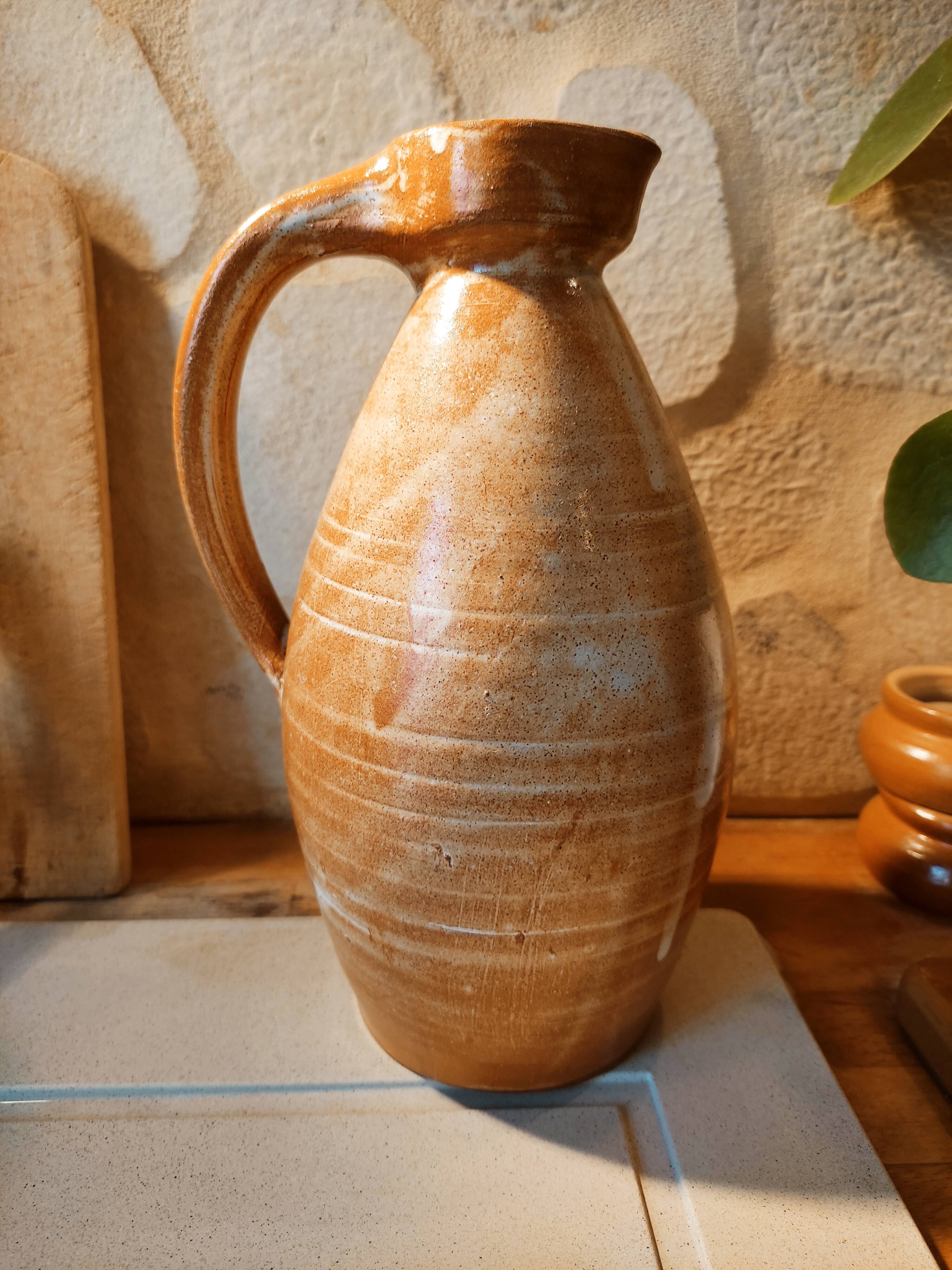 Duo of pitchers water, wine