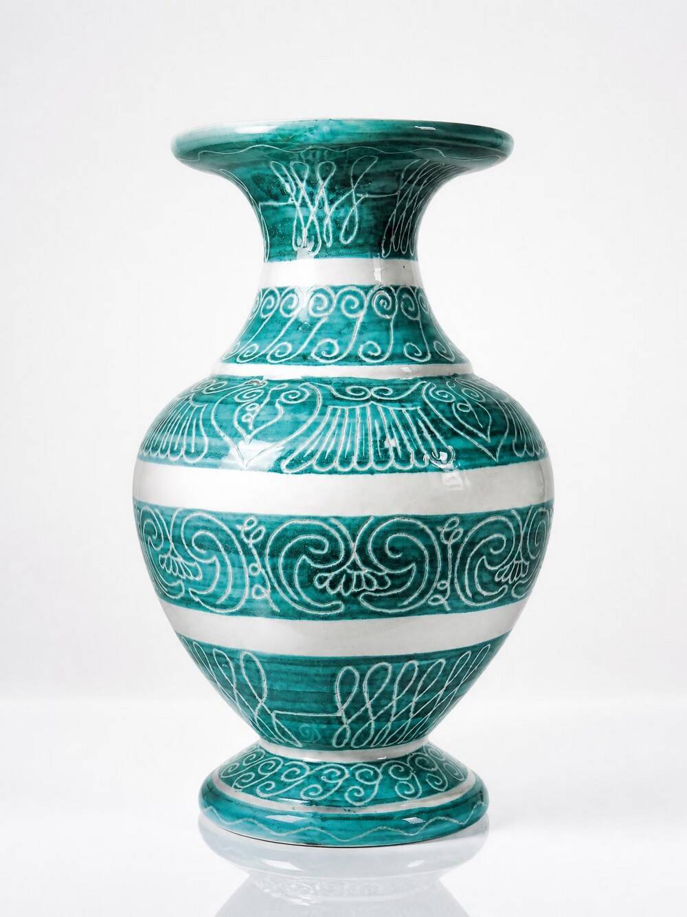 Vintage turquoise ceramic baluster vase with incised decoration.