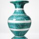 Vintage turquoise ceramic baluster vase with incised decoration.