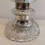 Table lamp made of transparent crystal glass and silver colored spacers.