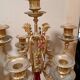 Pair of six-light candelabra in patinated and gilded bronze and spelter.