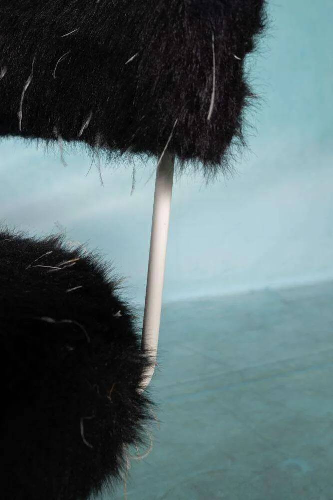 Space age design armchair from the sixties, fluffy stool with trumpet base.