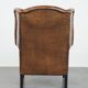 Large and comfortable sheepskin leather wingback chair with black piping