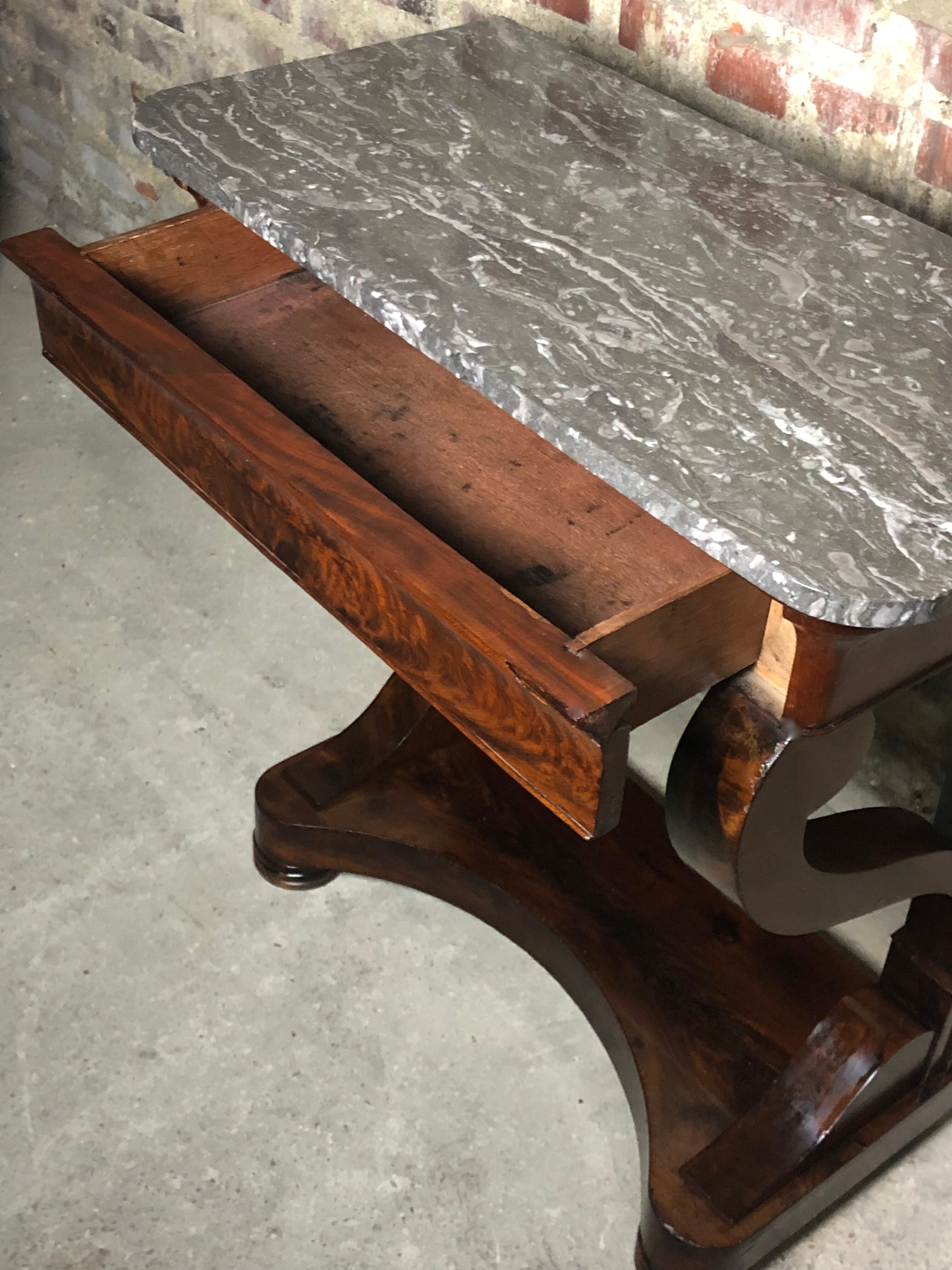 Console era restoration in mahogany veneer with St. Anne marble top.