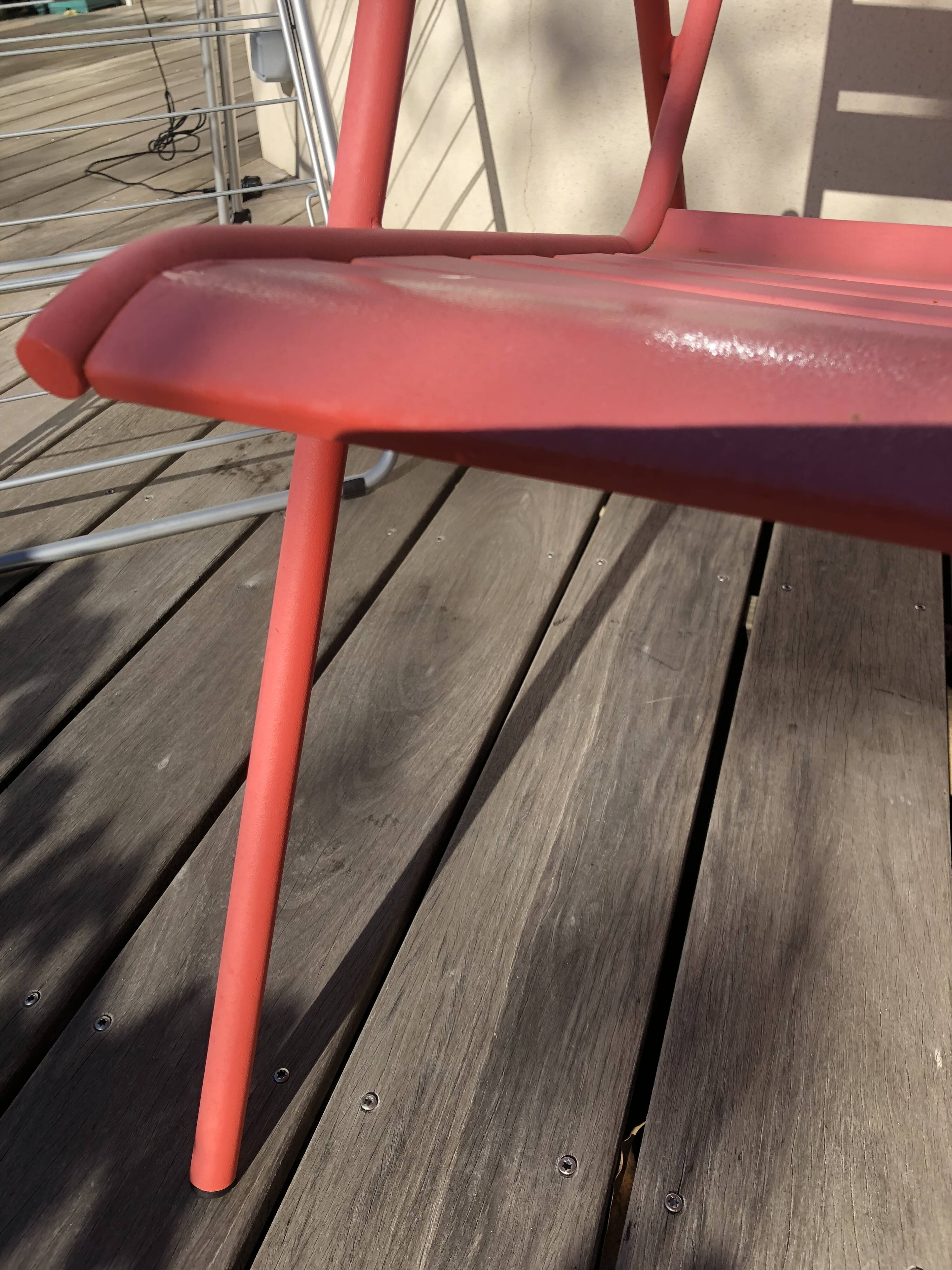 2 low chairs Fermob model Monceau in capucine colour.