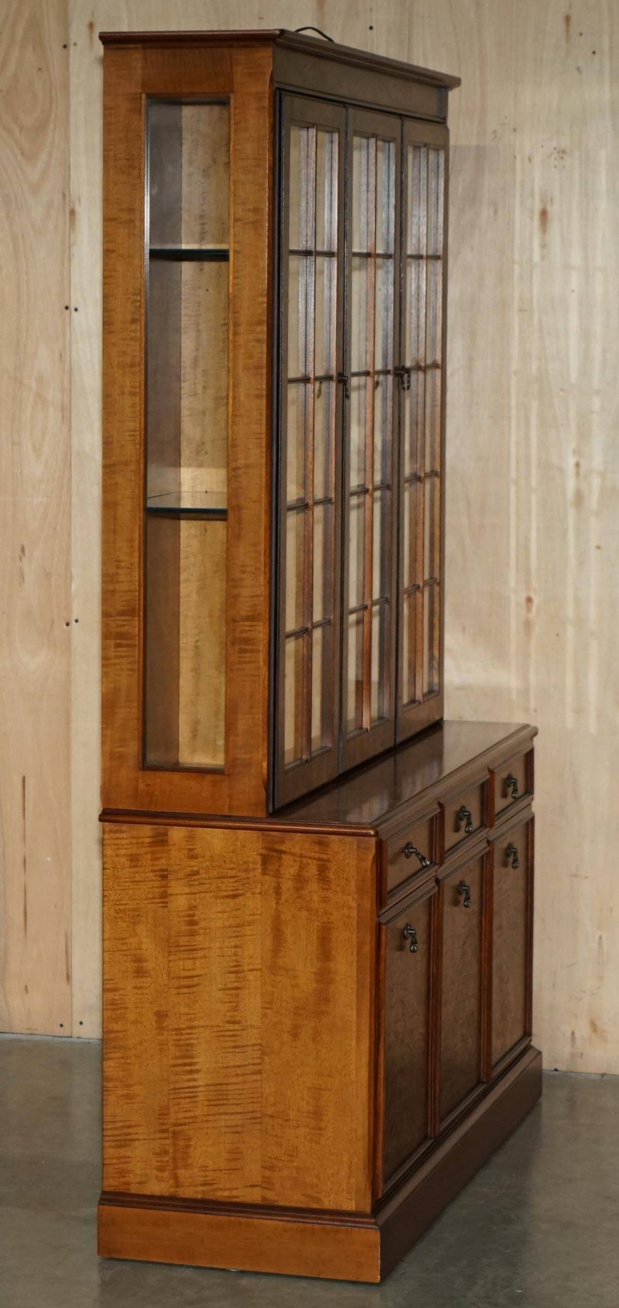 Vintage walnut burr buffet with glass and lighting, Art Deco style.
