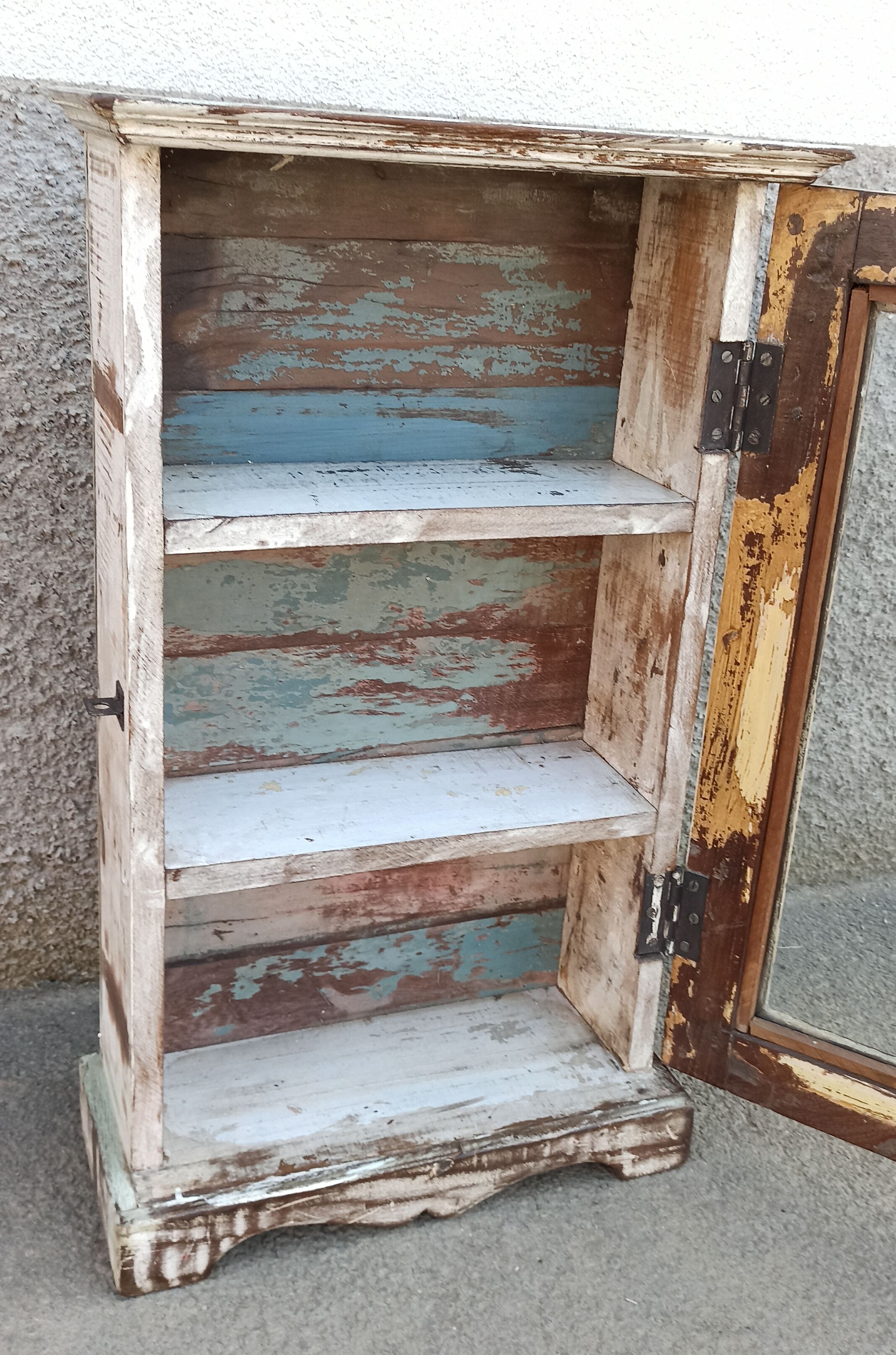 Old small wooden wardrobe with glass door