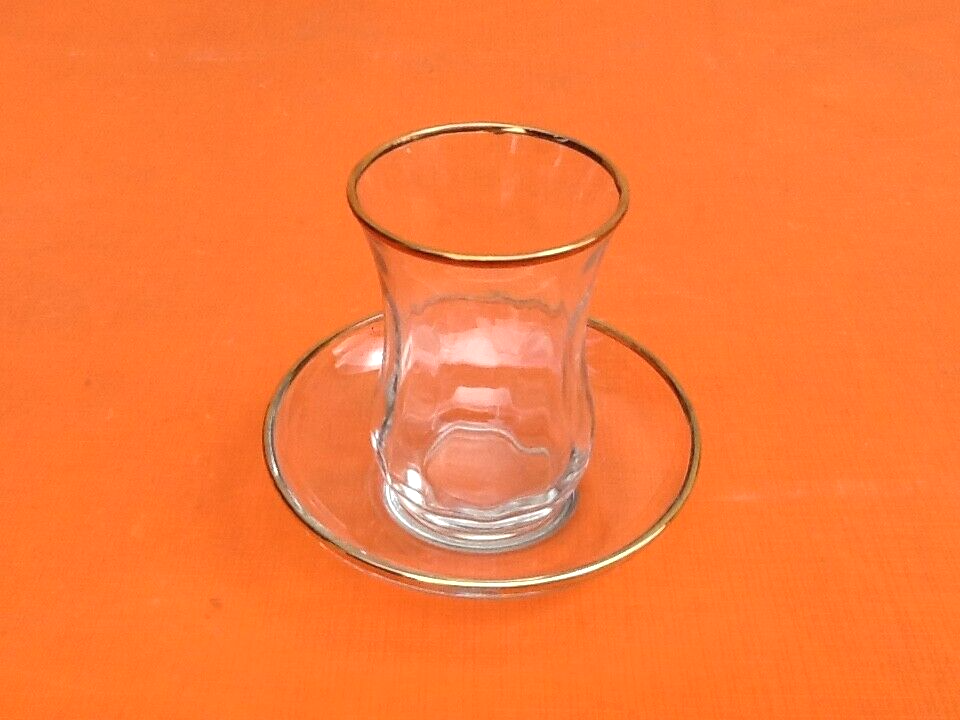 Transparent glass tea service with gilding.