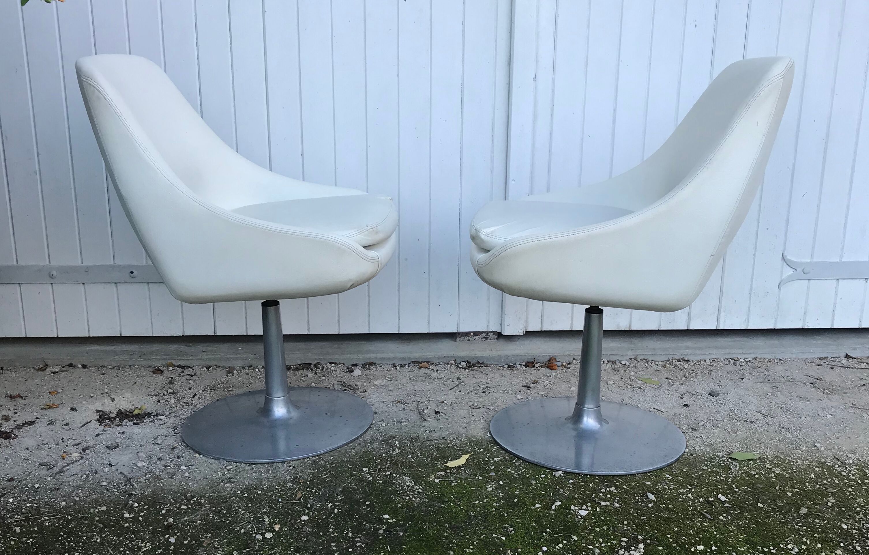 Pair of vintage armchairs with swivel tulip feet