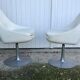 Pair of vintage armchairs with swivel tulip feet