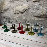 Antique and rare! Sold in a set of 12 colorful twisted stemmed glasses engraved with flowers and leaves