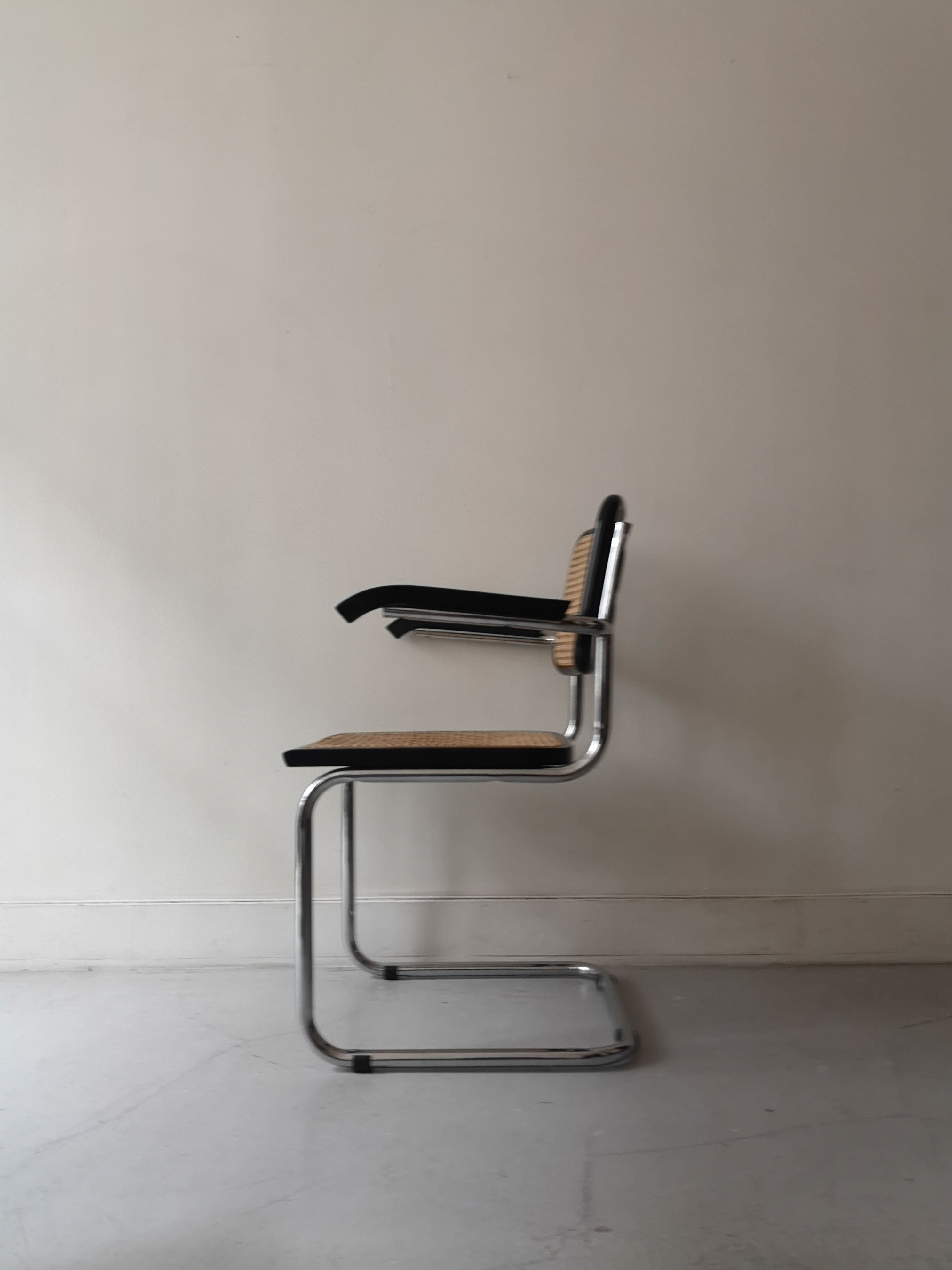 Cesca armchair with metal and wood armrest by Marcel Breuer