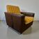 Fauteuil vintage brun / oker / un siège sur roulettes