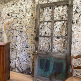 Old glazed wooden door patinated