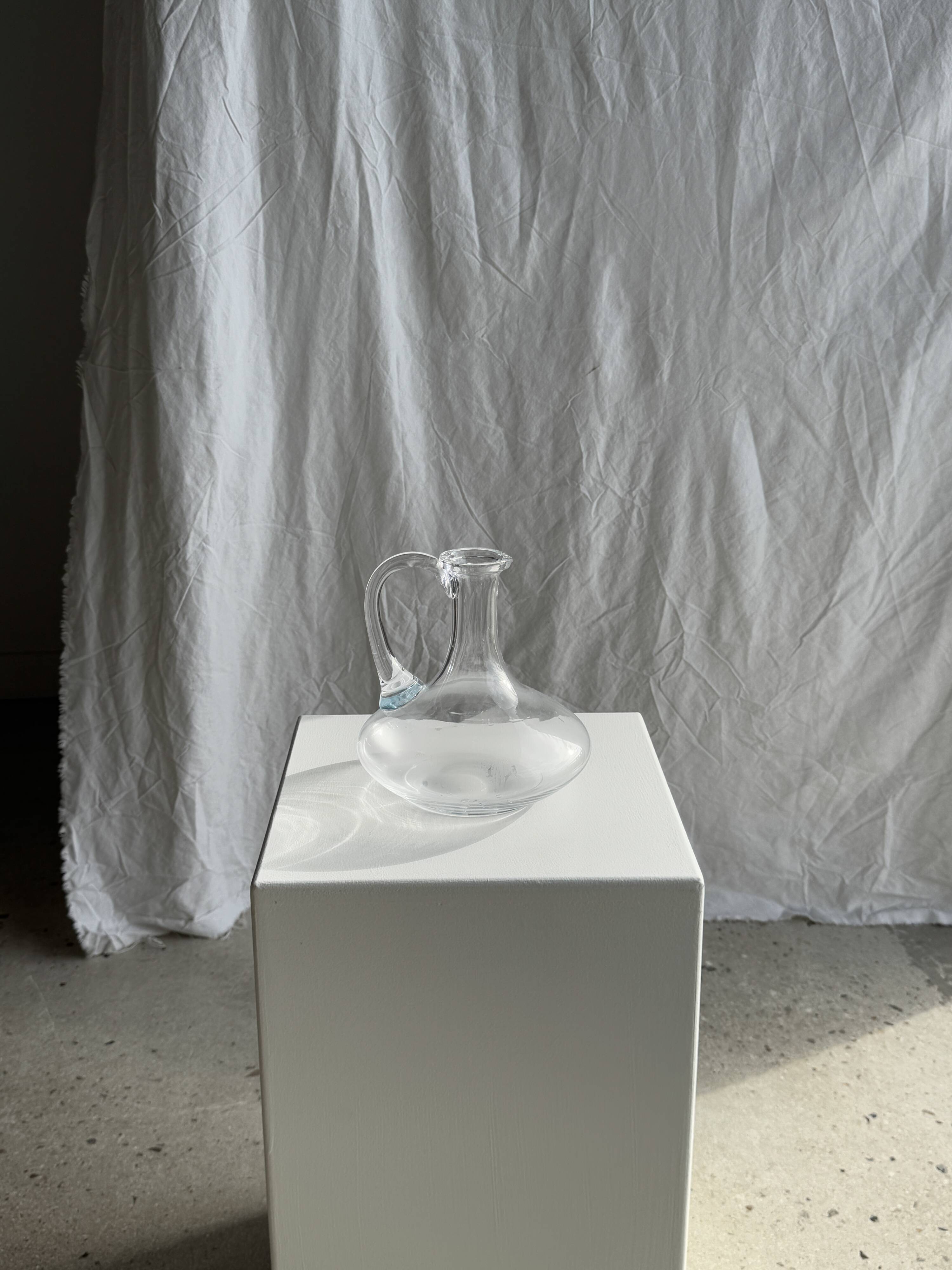 Vintage glass carafe with flattened flared belly handle H18