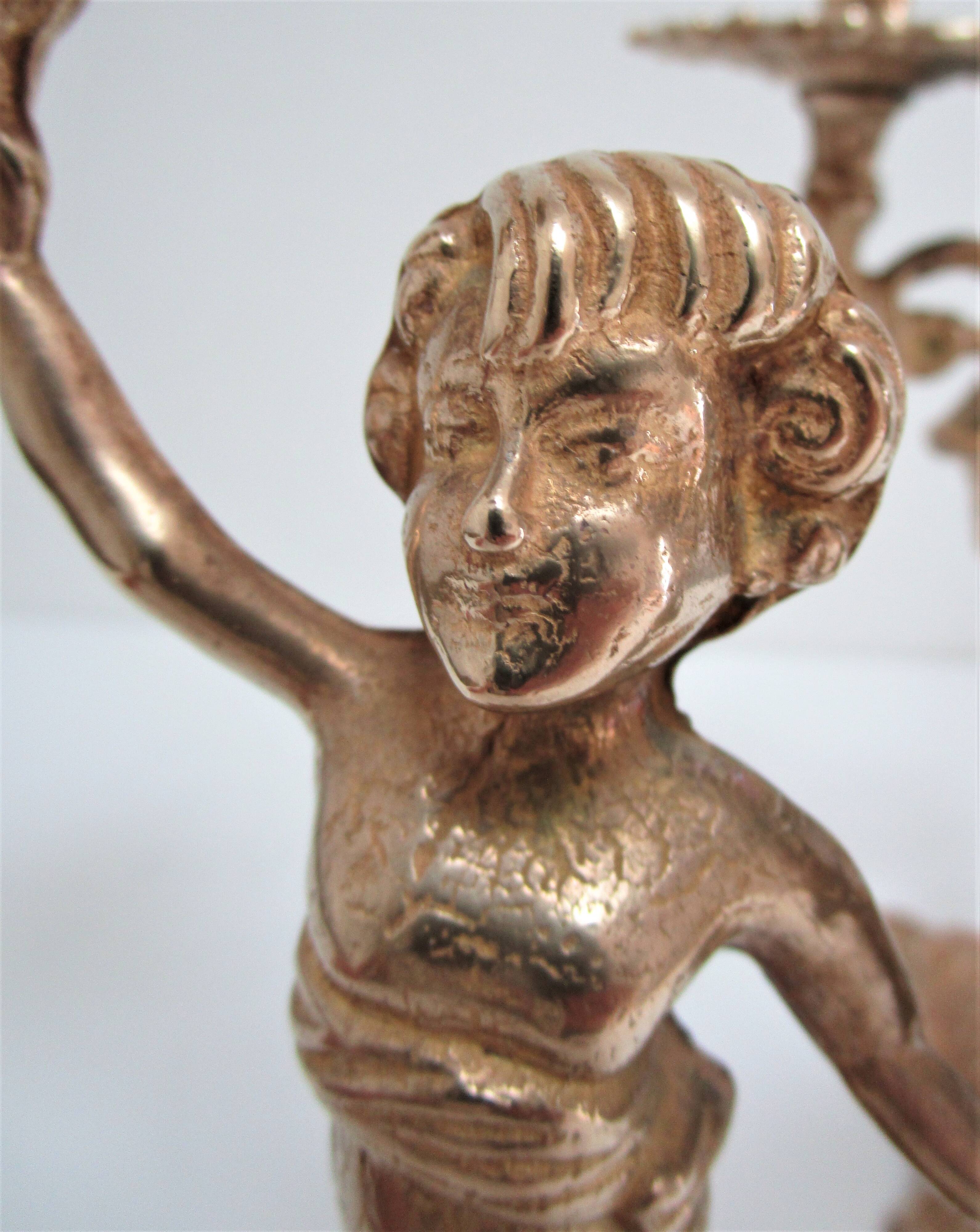 Pair of vintage golden brass cherub candlesticks