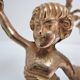 Pair of vintage golden brass cherub candlesticks