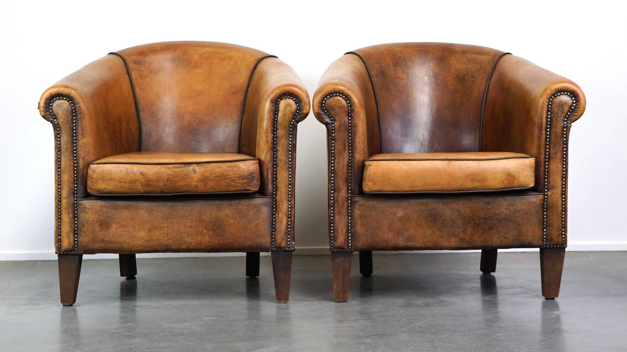 Set of 2 stylish yet beautiful and comfortable sheepskin club armchairs