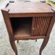 Pair of oak bedside tables with curtained niche doors