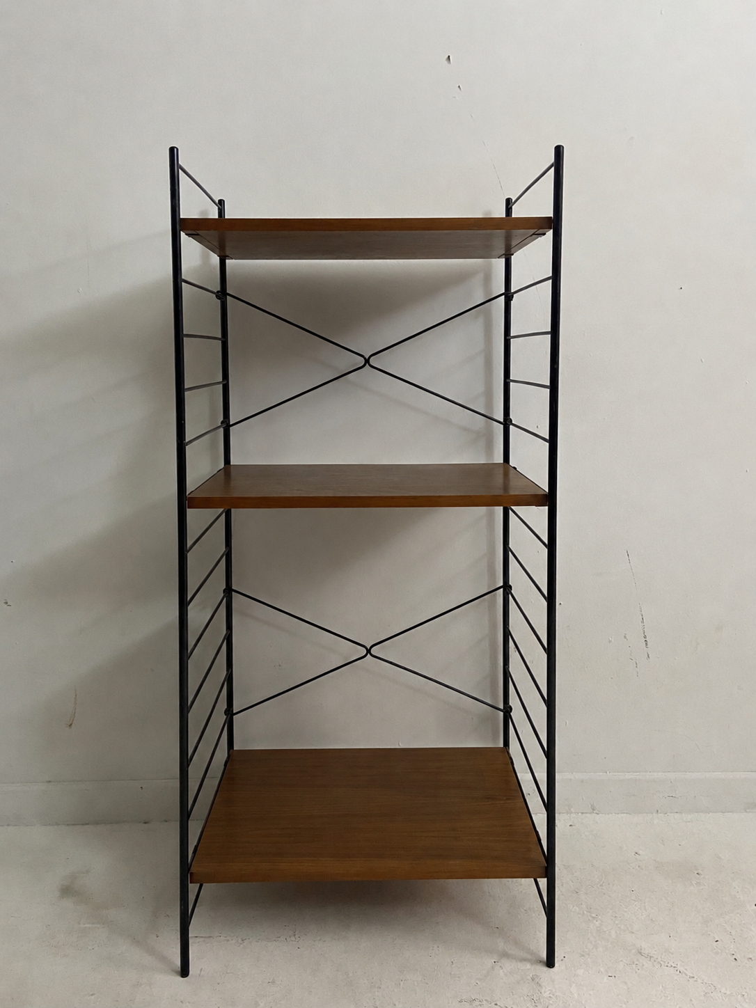 small vintage metal and teak string bookshelf