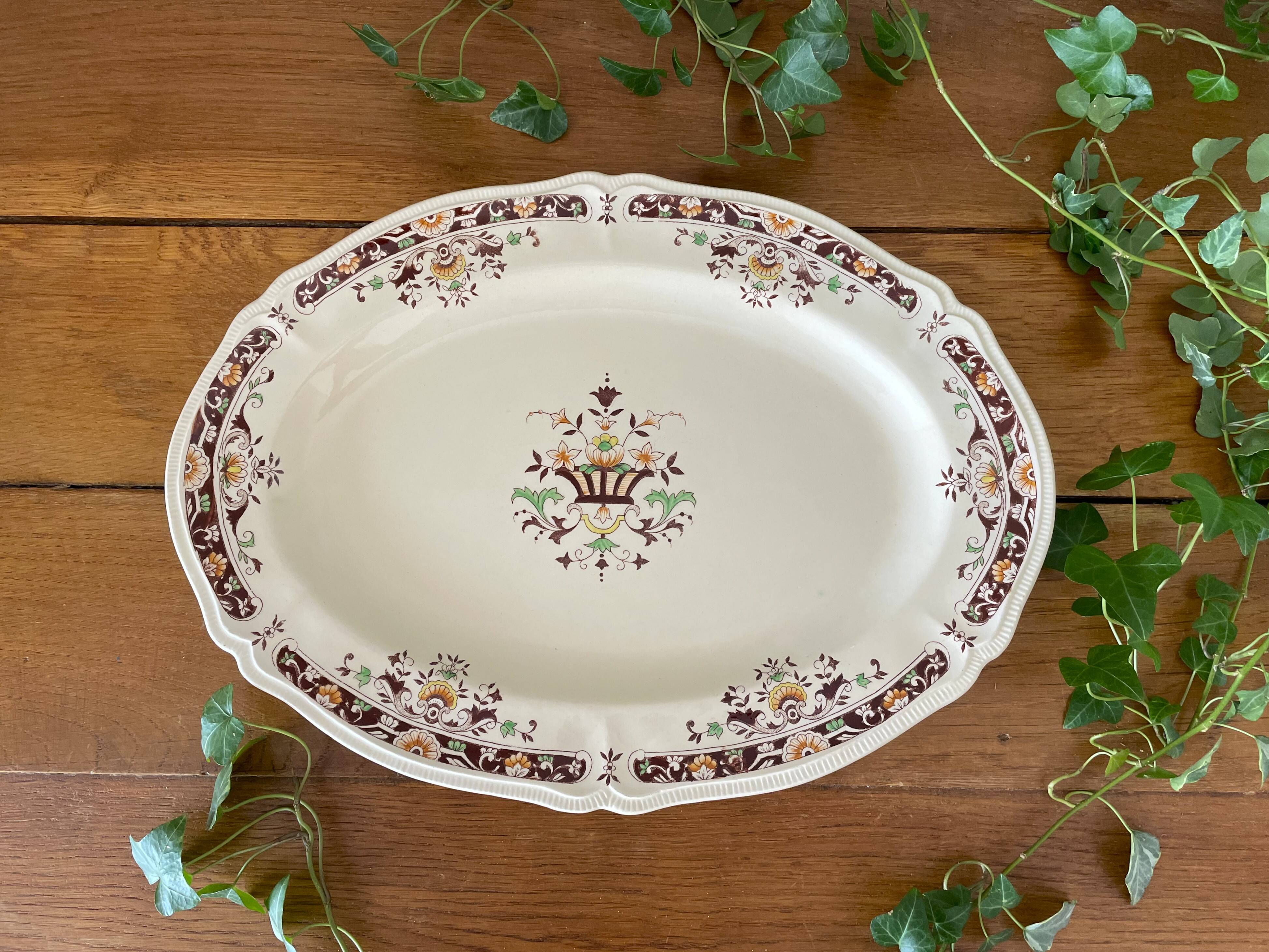 Antique serving dish in Longchamp earthenware.