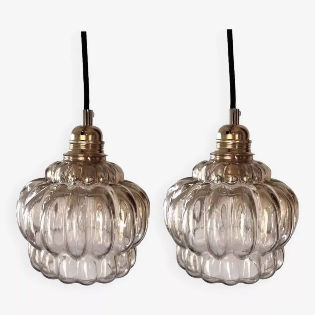 Set of two amber glass pendant lights