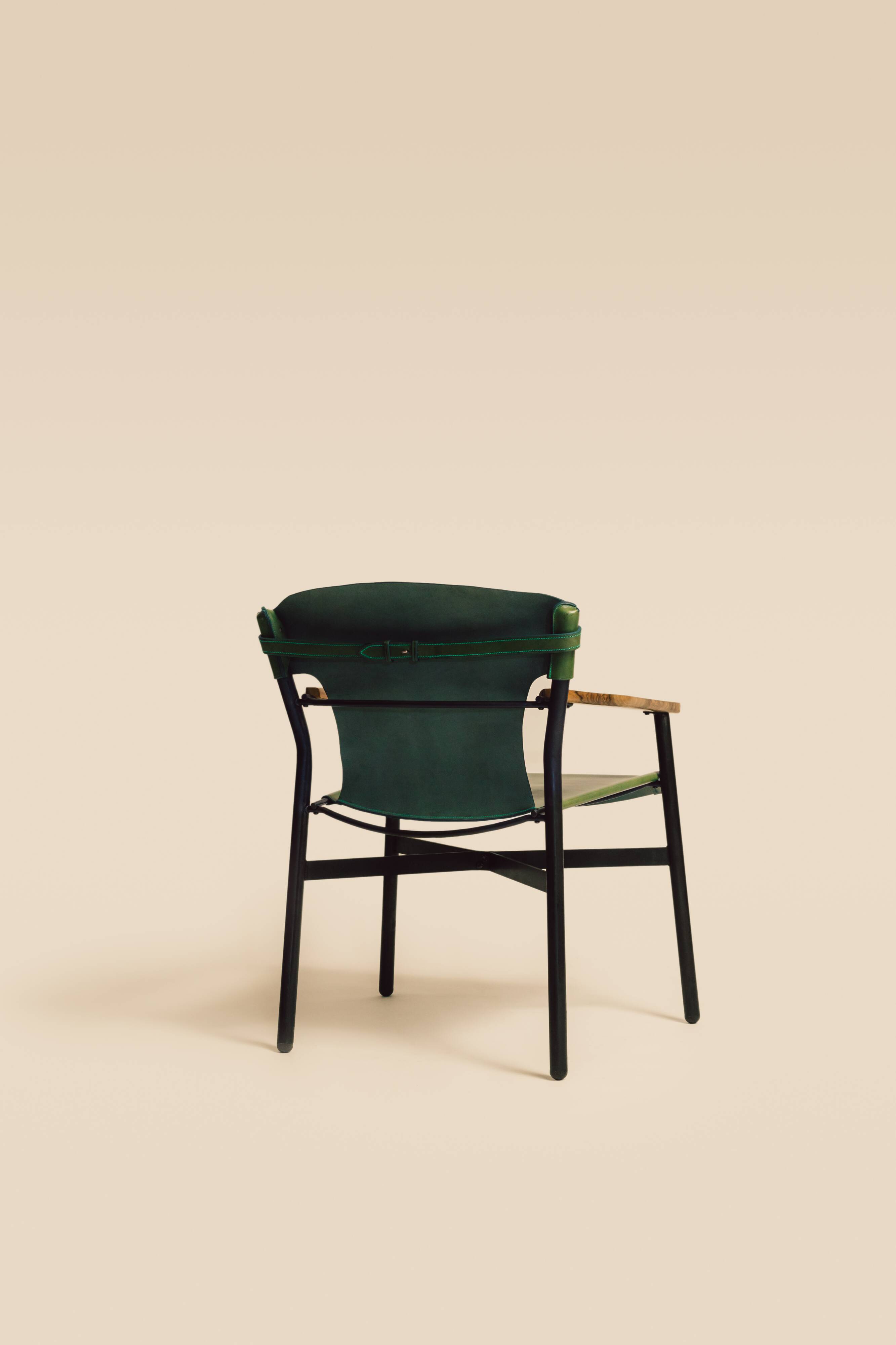 Maërl armchair, Galathée model, green leather, solid wood armrests of your choice