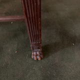 Antique armchair in carved wood with a straw seat.