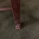Antique armchair in carved wood with a straw seat.