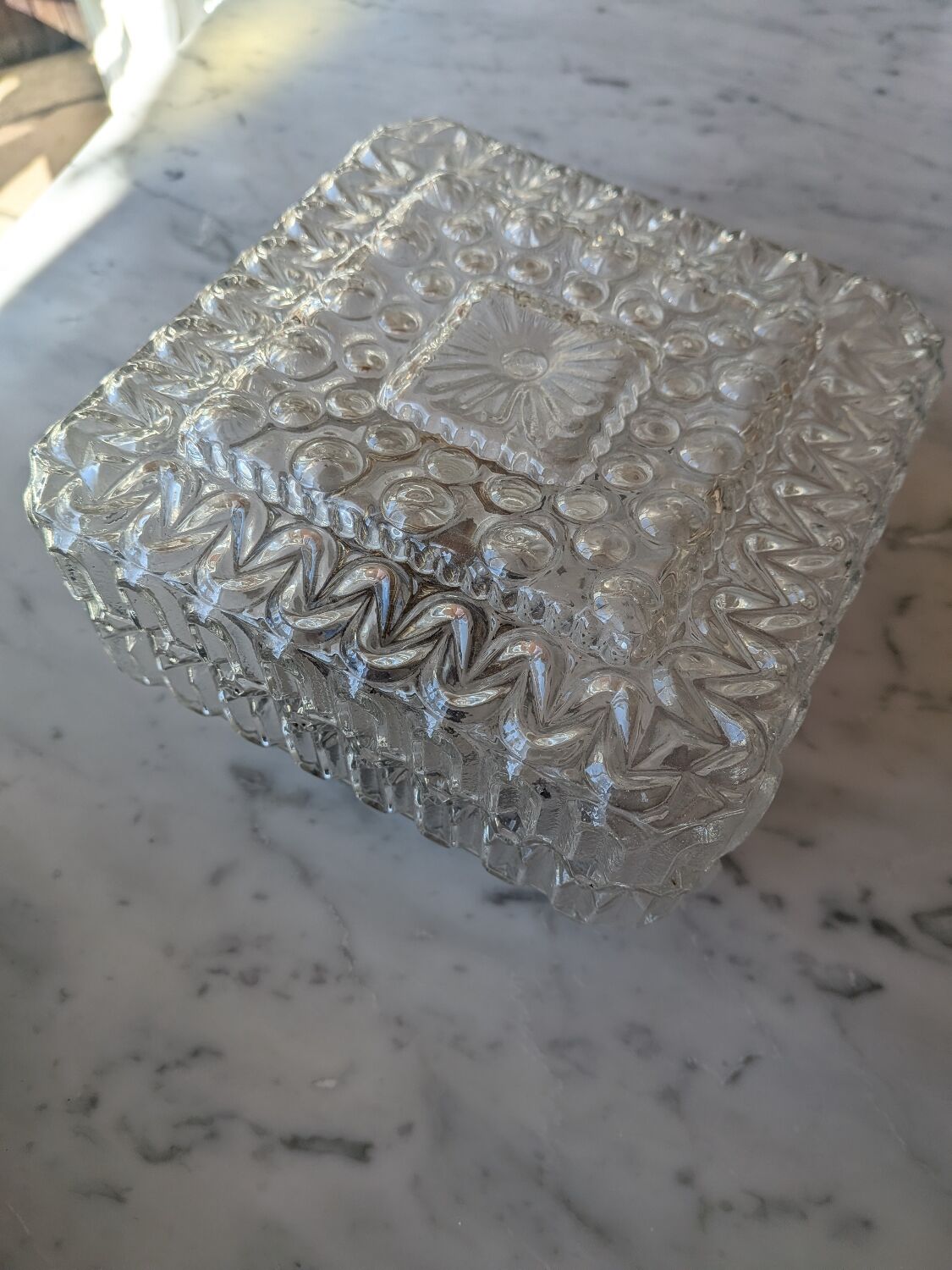 Pressed glass wall light