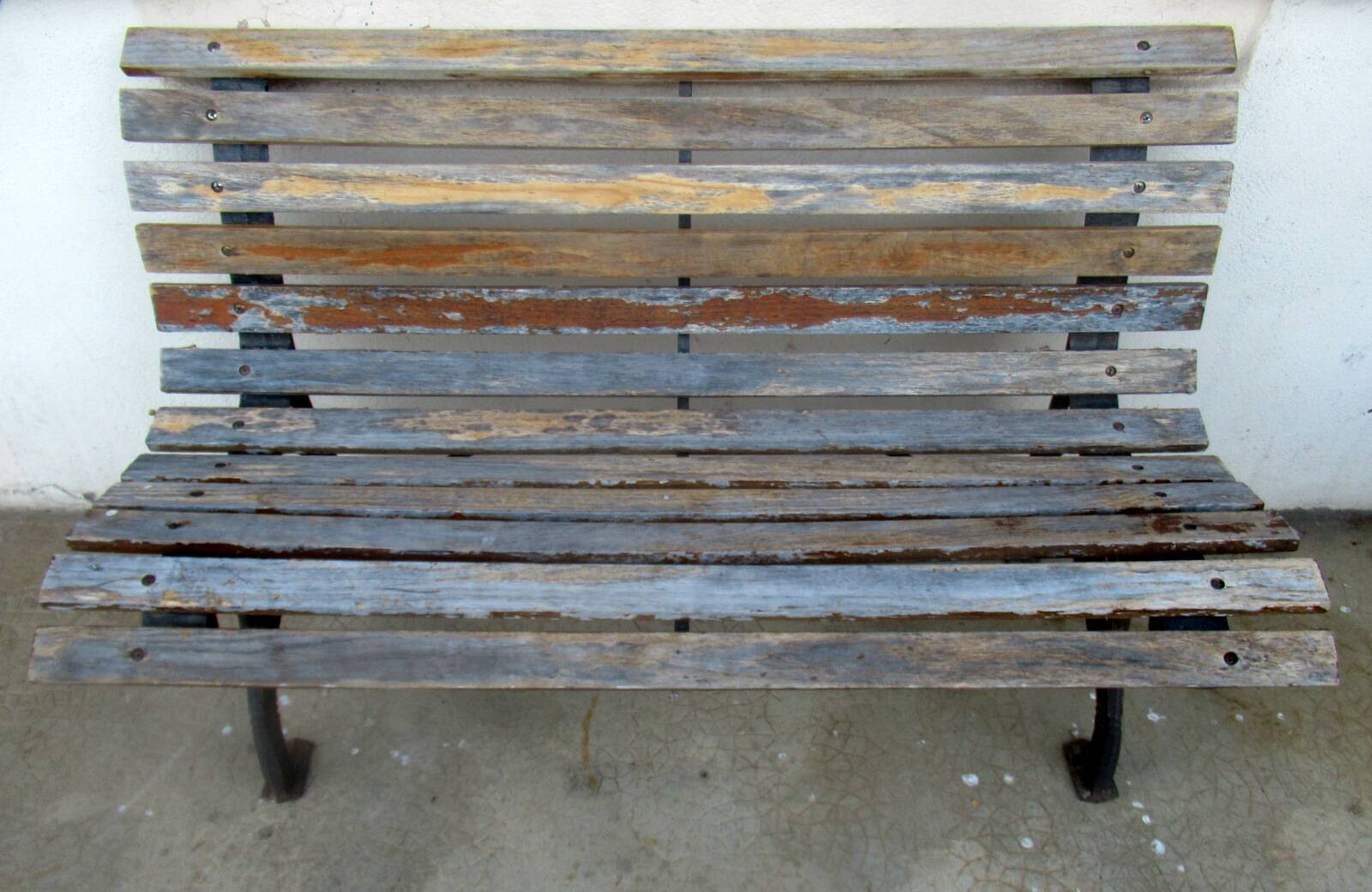 Small garden bench, with cast iron legs.