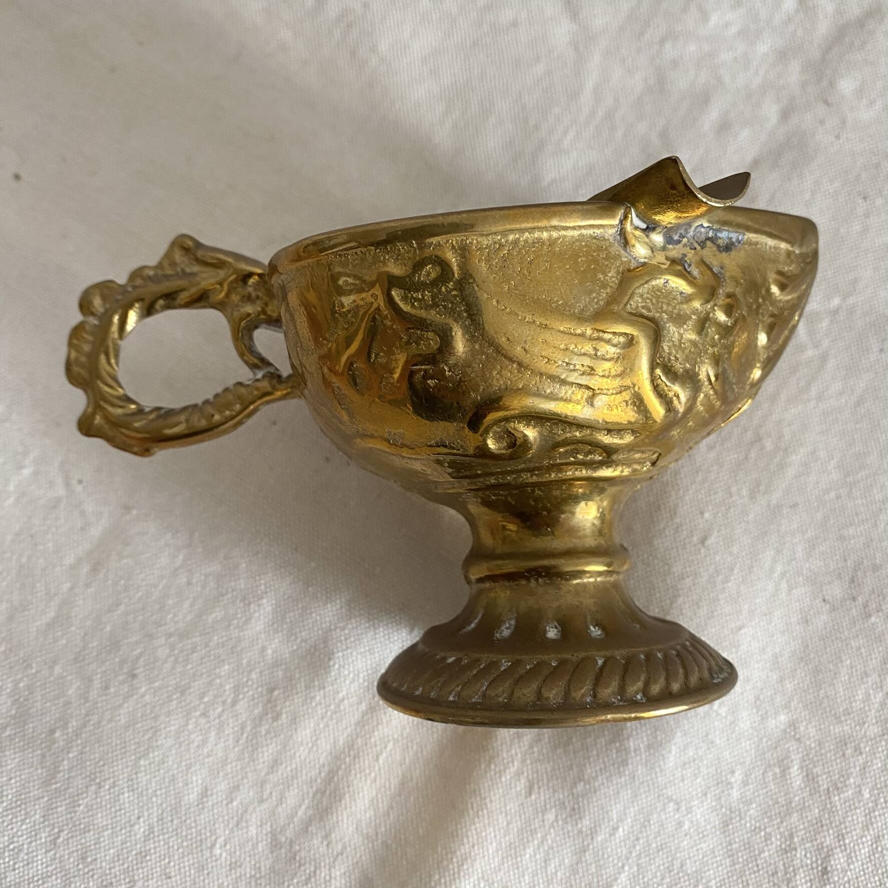 Antique embossed brass ashtray