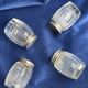 Set of hallmarked silver and fluted domed glass salt/pepper shakers