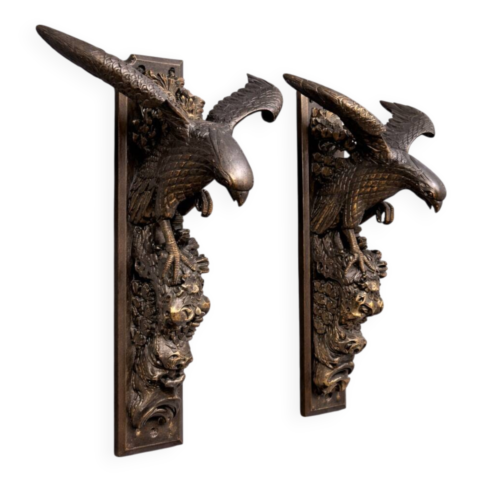 Rare pair of patinated wooden wall consoles, featuring two eagles with outstretched wings.