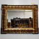 Miroir rectangulaire en bois et stuc teintés or – 1920