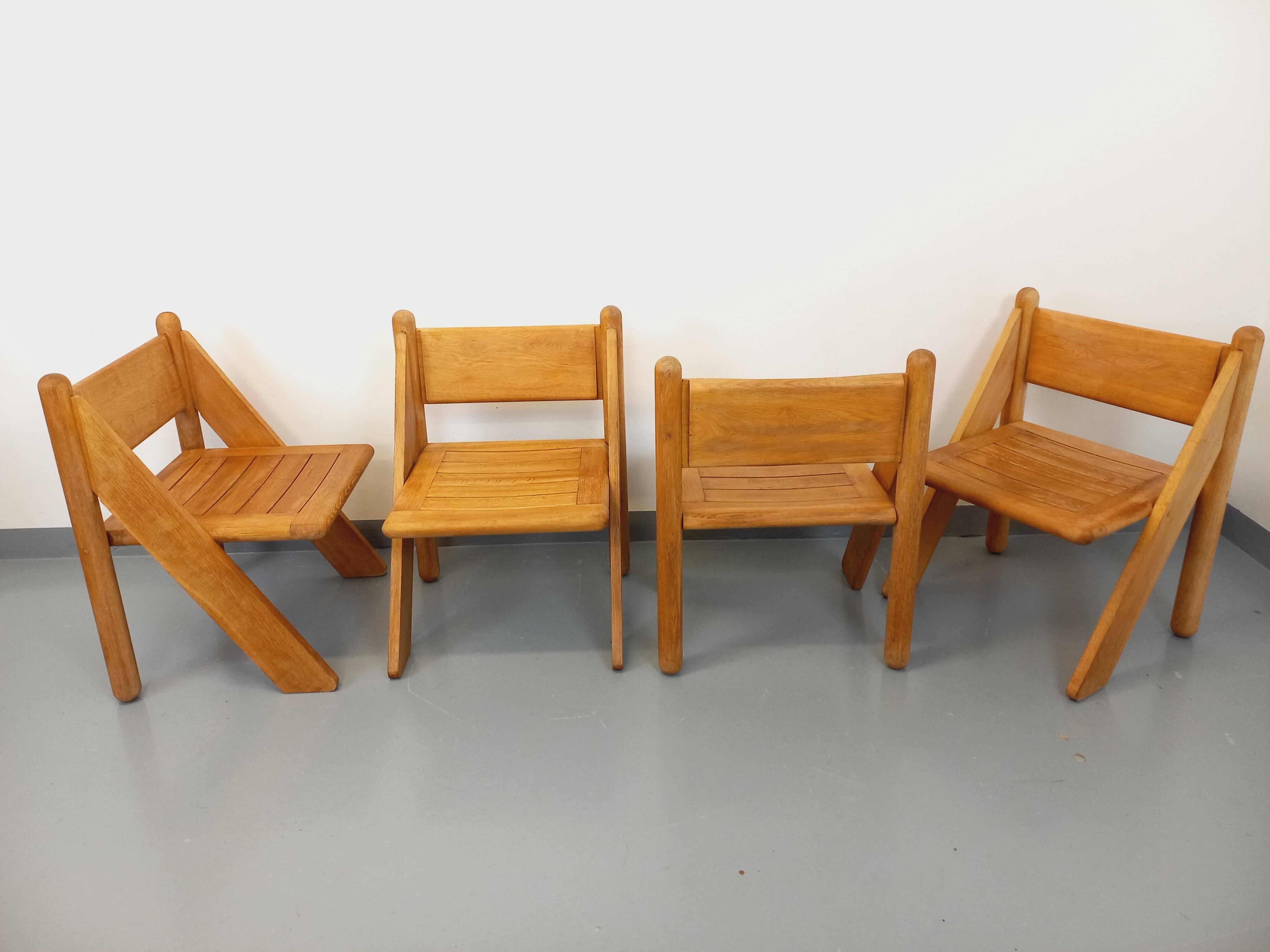 Set of 4 vintage brutalist chairs in solid oak from the 1960s.