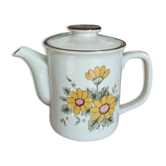 Old stoneware teapot with vintage flowers
