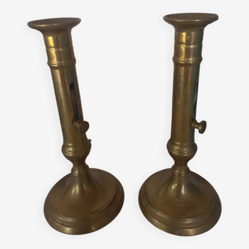 Pair of brass push-button candlesticks