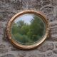 Miroir ovale vintage doré à décor floral et verre biseauté – 58 × 48 cm