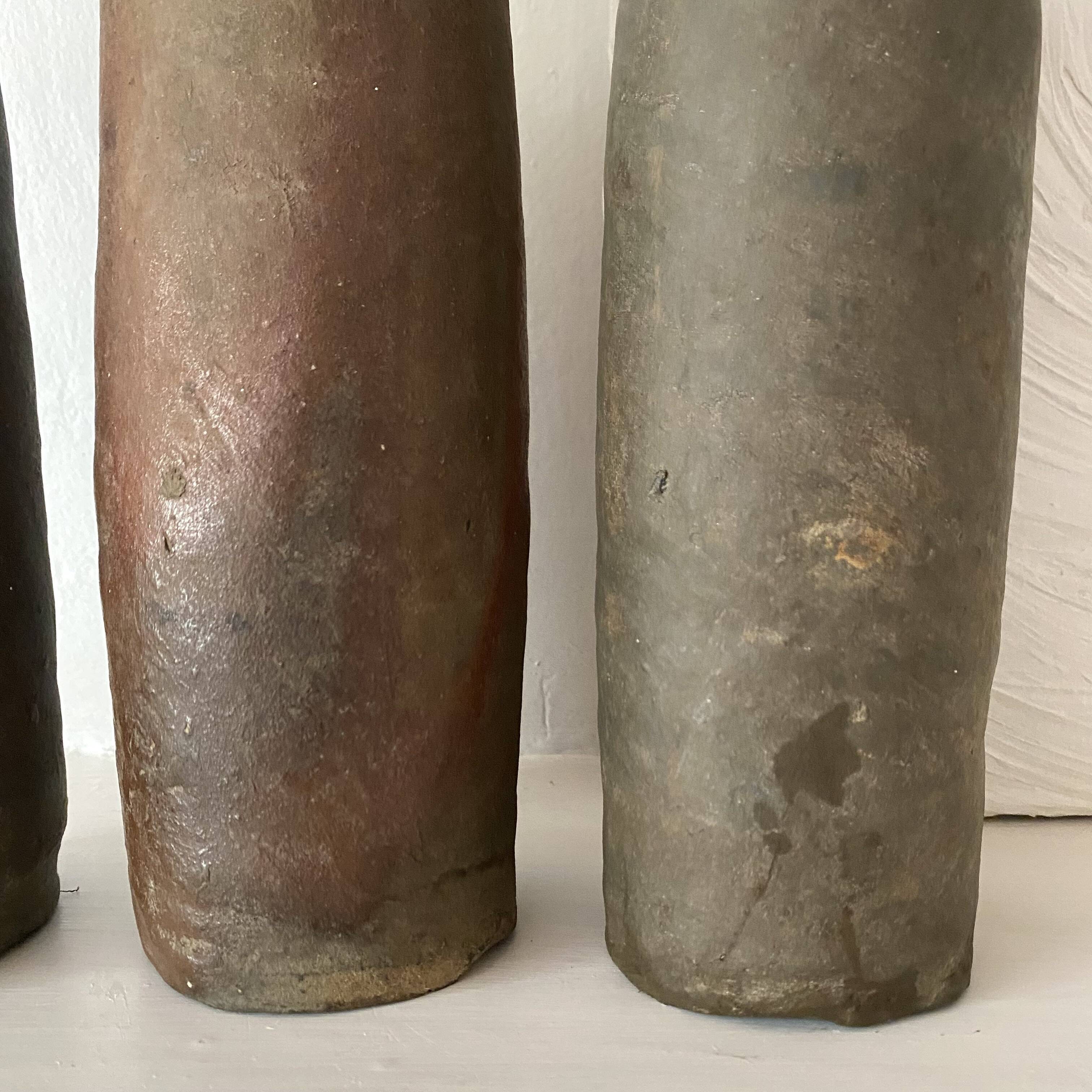 Antique terracotta cider bottles