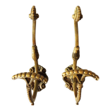 Pair of gilded bronze hooks Louis XVI style, nineteenth century.