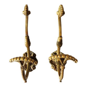 Pair of gilded bronze hooks Louis XVI style, nineteenth century.