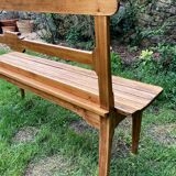 Old wooden bench with backrest, dated 1923