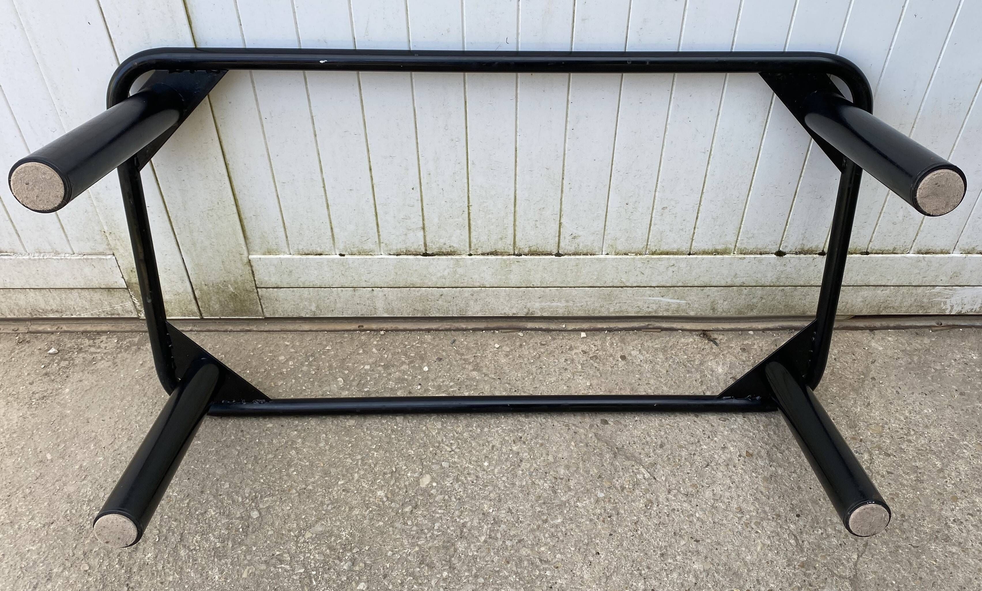 Black tubular coffee table with smoked glass by Yves Boutboul, 1980.
