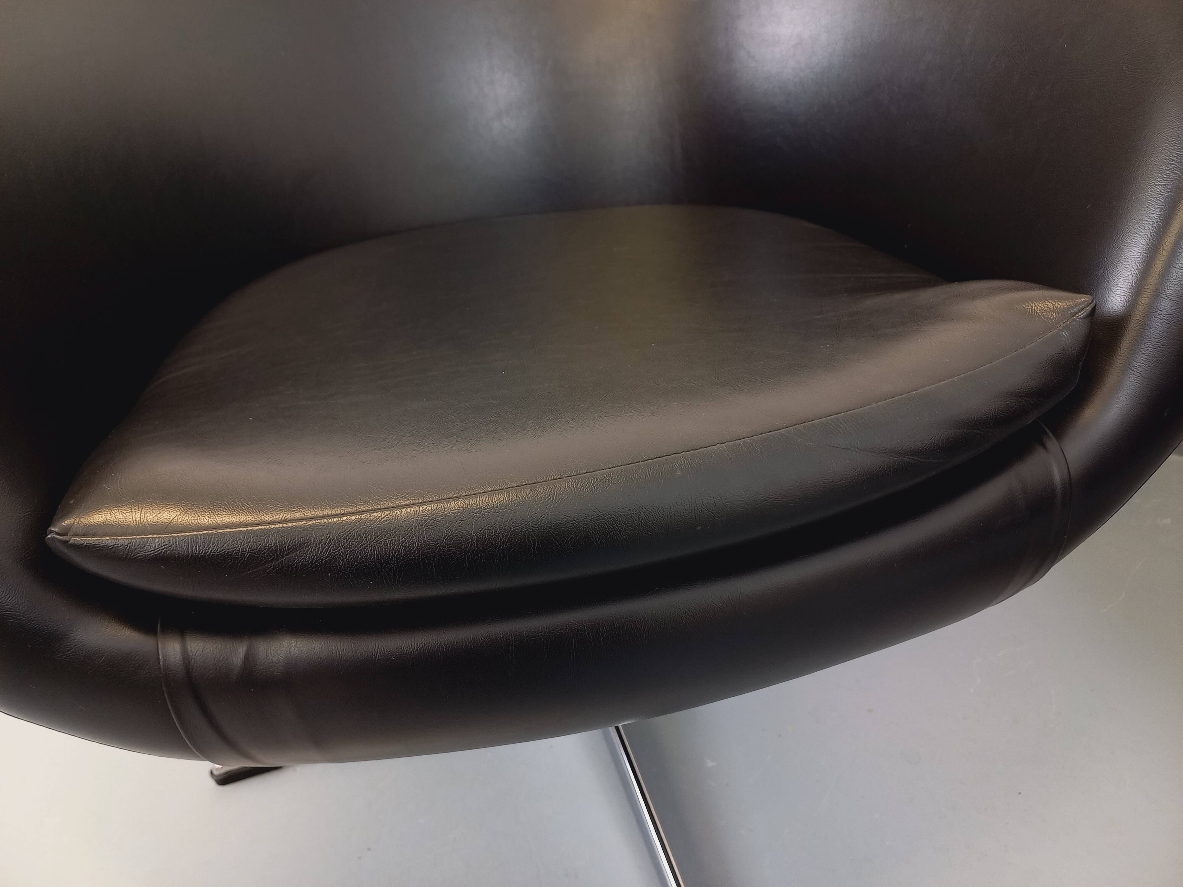 Pair of vintage Scandinavian swivel armchairs in faux leather and chrome.