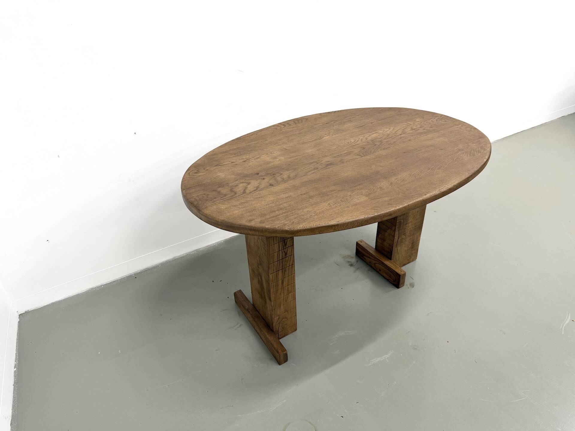 Oval table with T-shaped legs, solid oak, student woodworking project.